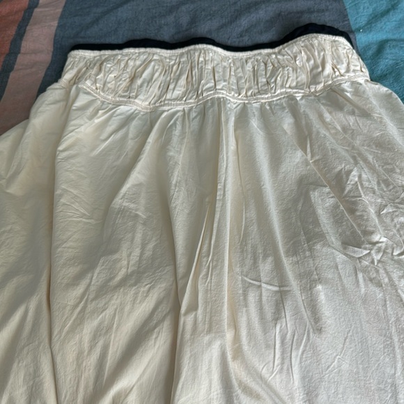 Maeve Strapless Pintuck Open-Back Dress. Color is Ivory with Black bodice trim. - Picture 2 of 5